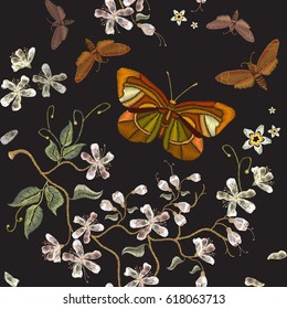 Sakura bloom embroidery. Beautiful flowers of cherry and machaons seamless pattern. Embroidery flowers, blooming cherry and butterflies seamless pattern 