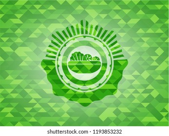 salad icon inside green emblem. Mosaic background