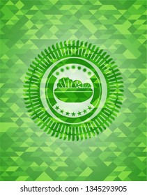 salad icon inside green emblem with mosaic ecological style background