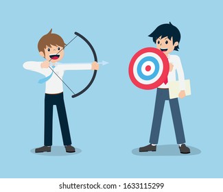 Salary Man stand and holding a shield in the form of a target And colleagues held a bow aim to target
