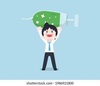 Salary man is very happy and lift a giant vaccine syringe. Having a vaccine, don't be afraid of the virus.
