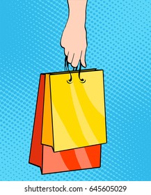 Sale, bags packages in the hands of women, pop art retro vector. Black Friday and holiday sales. A customer in the store. Stock vector illustration, hand draw