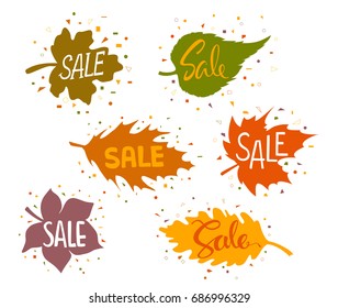 sale banners in shapes of forest autumn leaves with geometric confetti shapes elements around and handwritten sale texts