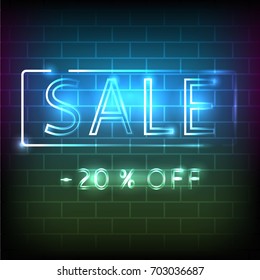 Sale neon sign on the brick wall.