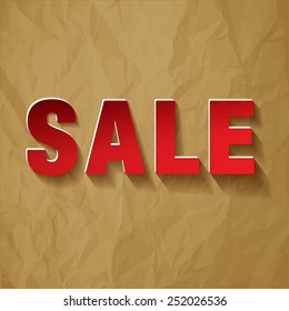 SALE paper symbol red on crumpled paper brown