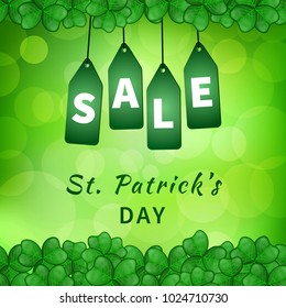 Sale poster of Saint Patrick's day with emerald shamrocks on green background bokeh and hanging green tags. Vector illustration