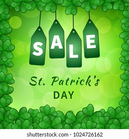 Sale poster of Saint Patrick's day with emerald shamrocks on green background bokeh and hanging green tags. Vector illustration