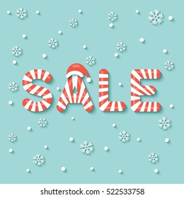 "SALE" sign in red and white Christmas sweet style on snow and snowflakes background.