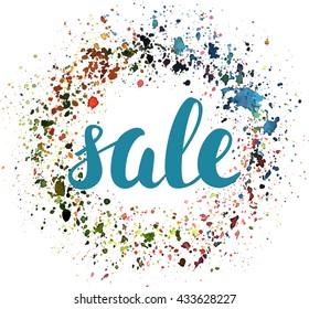 'Sale' sign, written in brushpen lettering, with an abstract artistic background texture, made up by splashes of various colours on white background; scalable vector graphic