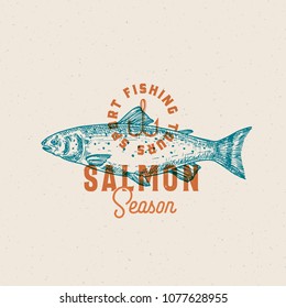 Salmon Fishing Season. Abstract Vector Sign, Symbol or Logo Template. Hand Drawn Salmon Fish with Classy Retro Typography. Vintage Vector Emblem with Retro Print Effect and Shabby Texture. Isolated.