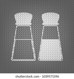 Salt and pepper sign. Vector. White knitted icon on gray knitted background. Isolated.