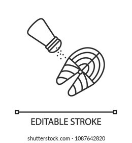 Salting fish steak linear icon. Thin line illustration. Pepper or salt shaker with salmon fish. Contour symbol. Vector isolated drawing. Editable stroke