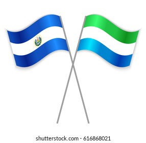 Salvadoran and Sierra Leonean crossed flags. El Salvador combined with Sierra Leone isolated on white. Language learning, international business or travel concept.