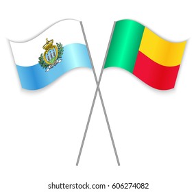 Sammarinese and Beninese crossed flags. San Marino combined with Benin isolated on white. Language learning, international business or travel concept.