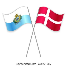 Sammarinese and Danish crossed flags. San Marino combined with Denmark isolated on white. Language learning, international business or travel concept.