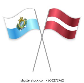 Sammarinese and Latvian crossed flags. San Marino combined with Latvia isolated on white. Language learning, international business or travel concept.