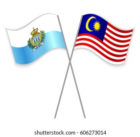 Sammarinese and Malaysian crossed flags. San Marino combined with Malaysia isolated on white. Language learning, international business or travel concept.