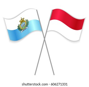 Sammarinese and Monegasque crossed flags. San Marino combined with Monaco isolated on white. Language learning, international business or travel concept.