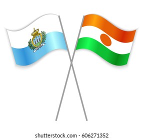 Sammarinese and Nigerien crossed flags. San Marino combined with Niger isolated on white. Language learning, international business or travel concept.