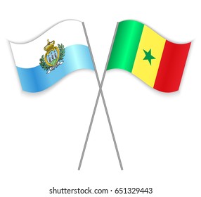 Sammarinese and Senegalese crossed flags. San Marino combined with Senegal isolated on white. Language learning, international business or travel concept.