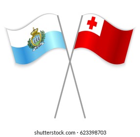 Sammarinese and Tongan crossed flags. San Marino combined with Tonga isolated on white. Language learning, international business or travel concept.