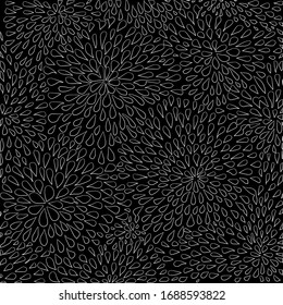 A sample of white drops on a black background, diverging from the center in a circle. Round flowers made of drops.