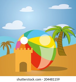 a sand castle and a beach ball in the beach
