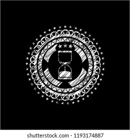 sand clock icon drawn on blackboard