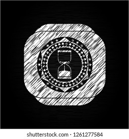 sand clock icon drawn on blackboard