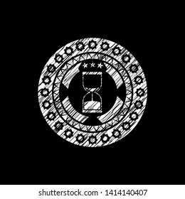 sand clock icon drawn on a blackboard