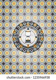 sand clock icon inside arabesque emblem background. arabic decoration.