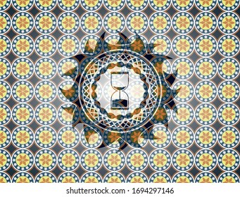 sand clock icon inside arabesque emblem background. arabic decoration.