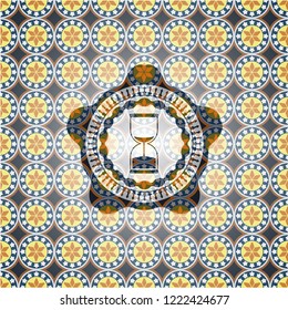 sand clock icon inside arabic style badge. Arabesque decoration.