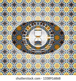 sand clock icon inside arabic badge background. Arabesque decoration.