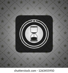 sand clock icon inside black badge