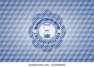 sand clock icon inside blue emblem with geometric background.