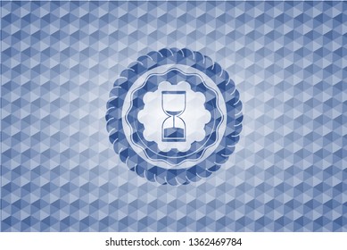 sand clock icon inside blue emblem with geometric background.