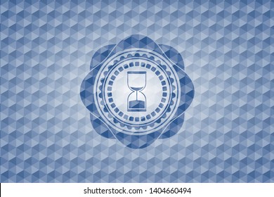 sand clock icon inside blue emblem or badge with abstract geometric pattern background.