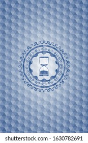 sand clock icon inside blue emblem with geometric pattern.