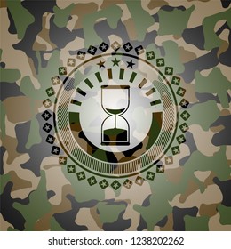 sand clock icon inside camo emblem