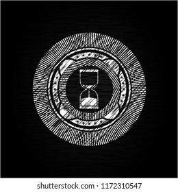 sand clock icon inside chalkboard emblem