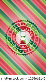 sand clock icon inside christmas badge background.