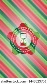sand clock icon inside christmas style emblem.