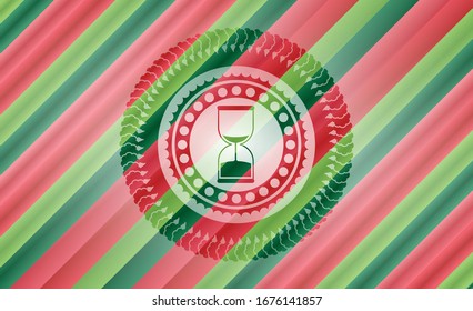 sand clock icon inside christmas style badge..