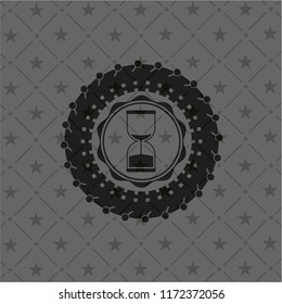 sand clock icon inside dark badge