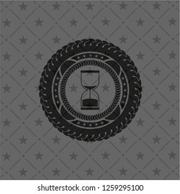 sand clock icon inside dark badge or emblem