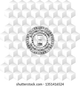 sand clock icon inside grey badge with geometric cube white background