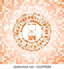 sand clock icon inside orange mosaic emblem