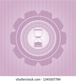 sand clock icon inside pink emblem