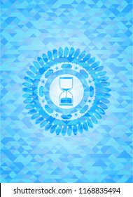 sand clock icon inside realistic sky blue emblem. Mosaic background